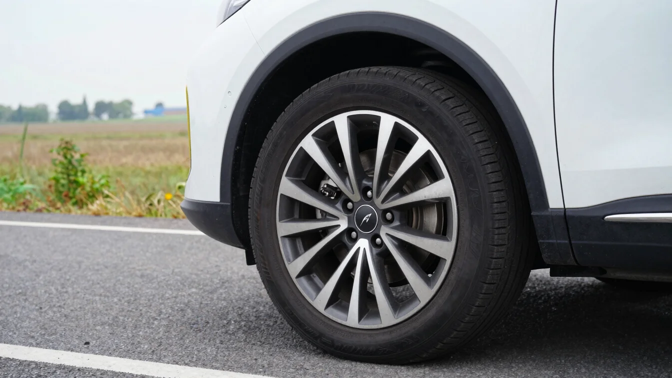 Editorial automotive photo of a car on a rural road beside flat p